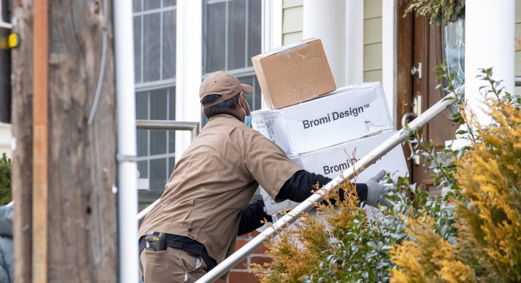 a man delivering packages for money