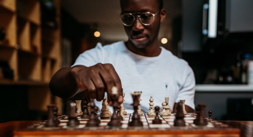 man playing chess thinking 